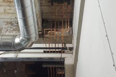 Exposed refrigeration piping for a VRF system installed in for a shared office space. Piping was later insulated with PVC Jacketing to achieve a clean, white appearance.