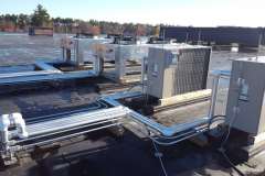 Refrigeration pipinng for roof-mounted Liebert condensers providing supplemental cooling for an IT room.