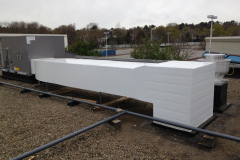 Exterior insulation on roof-mounted ductwork for a packaged rooftop unit. This insulation is an excellent way to improve the look of exposed exterior ductwork.