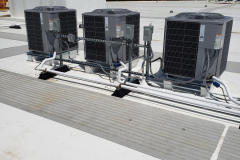 Condensing units installed for a storage facility located in Waltham, MA. Each condensing unit is connected to a high-efficiency gas furnace within the space.