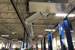 Exposed plenum & spiral ductwork for a 25-ton Rooftop Unit for a service bay within an Auto Dealership